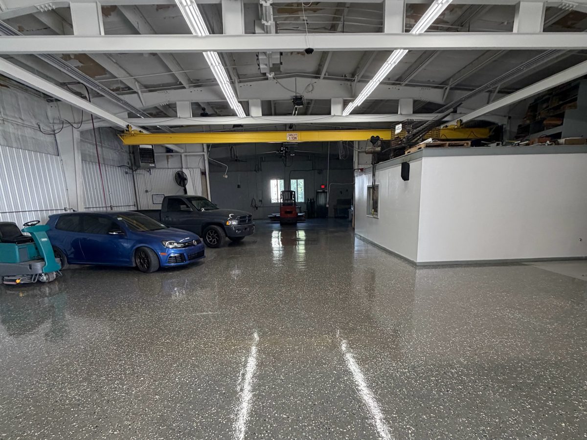 Auto body shop floor with ceiling cameras and Wi-Fi coverage